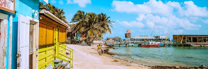 Colorful houses on a sandy beach in Belize
