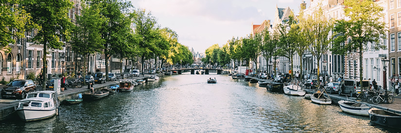 Shot of boats and houses in Amsterdam